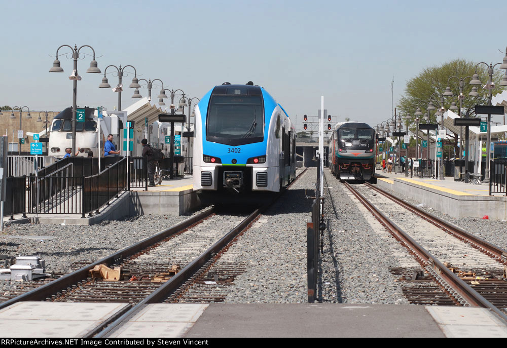 Metrolink San Bernardino Downtown Transit center with DMU #3402 to Redlands, SCAX #916 to Los Angeles, &, SCAX 889 (train 815) scheduled to Oceanside.